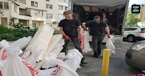 Workers loading debris.