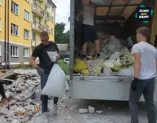 Workers loading debris.