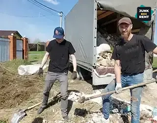 Clearing debris with shovels.