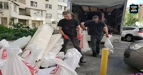 Workers loading debris.