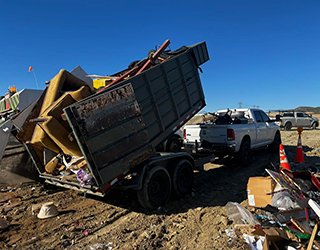Trailer dumping debris.